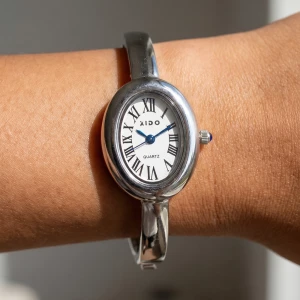 Roman Numeral Oval Dial Bangle Cuff Watch