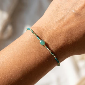 Faceted Bead Stretch Bracelet With Oval Stone