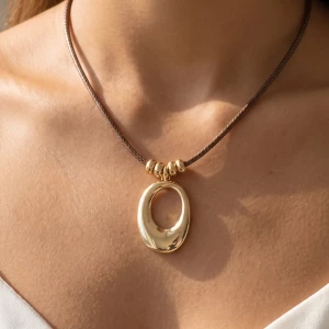Sculpted Open Oval Pendant Cord Necklace