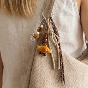 Safety Pin And Ceramic Croissant Bag Charm